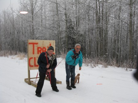 Alex and Leroy dragging sign