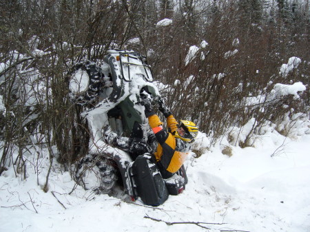 Luc climbing tree with quad